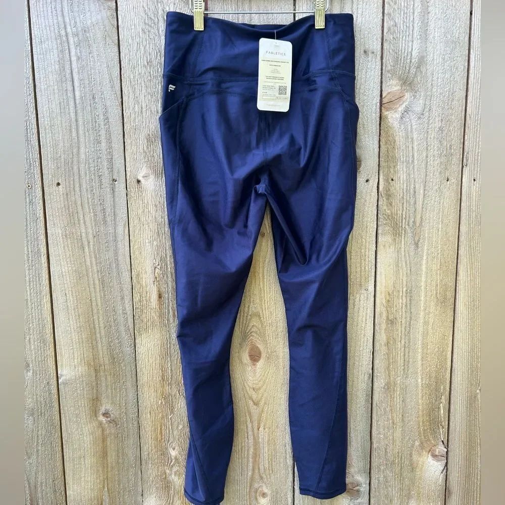 Fabletics Navy Oasis Shine High Waisted Pocket 7/8 Legging - Picture 4 of 9